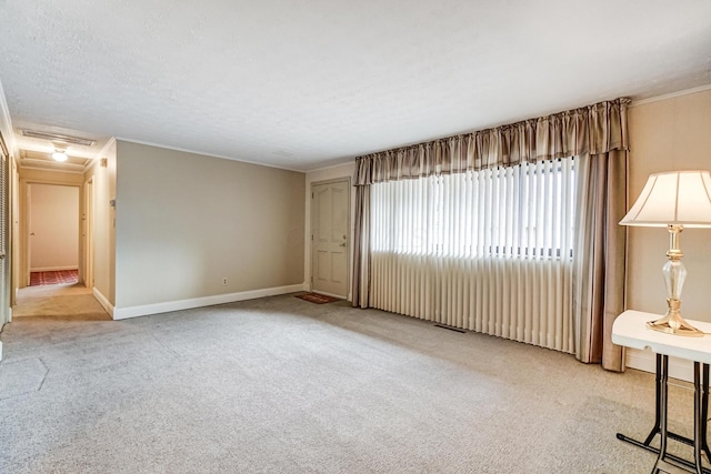 empty room featuring light carpet