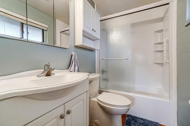 full bathroom featuring toilet, vanity, and bathing tub / shower combination