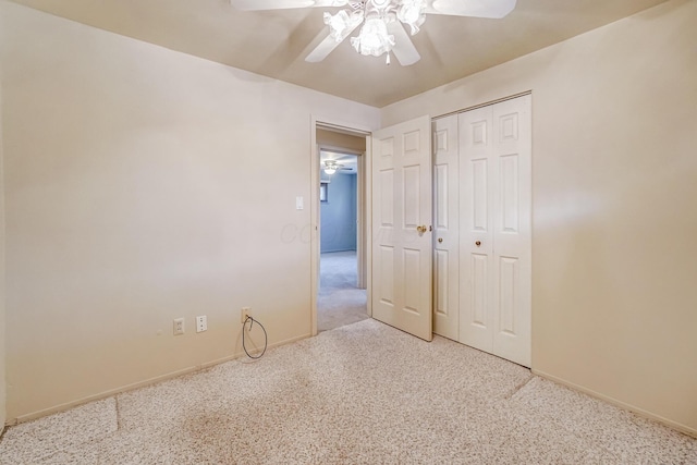 unfurnished bedroom featuring ceiling fan, a closet, and carpet floors