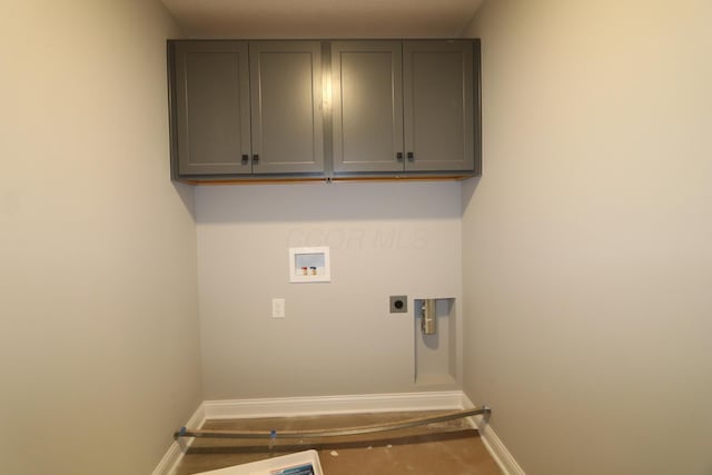 laundry room featuring cabinets, washer hookup, and hookup for an electric dryer