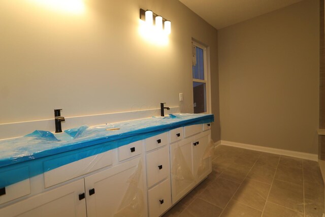 bathroom with vanity and tile patterned floors