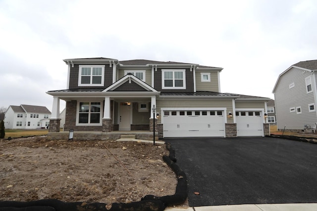 view of front of house with a garage and covered porch