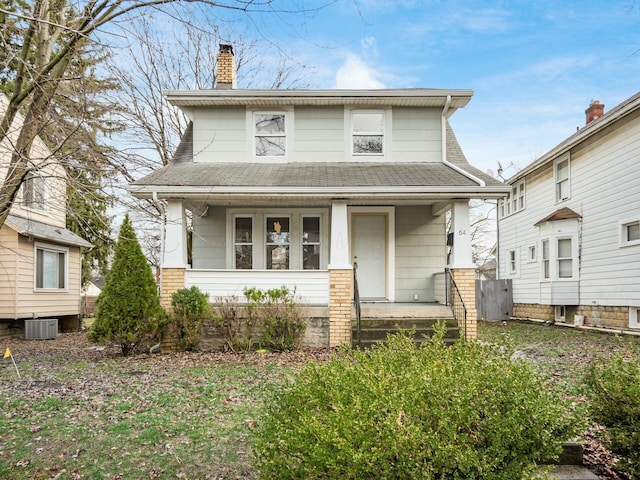 view of front facade featuring a porch and cooling unit