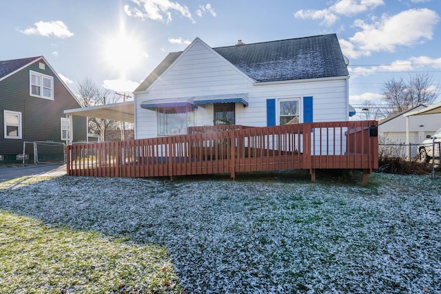 rear view of house with a wooden deck