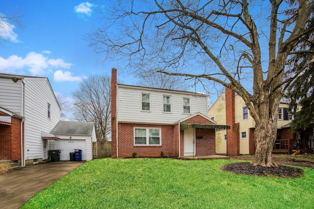 front of property featuring a garage and a front lawn