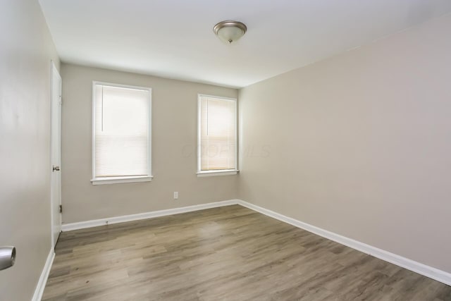 unfurnished room featuring light hardwood / wood-style floors