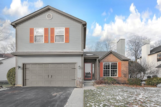 front of property with a garage