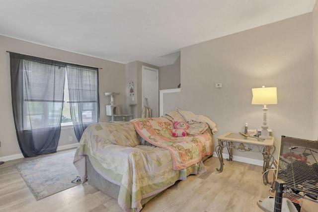 bedroom featuring light wood-type flooring