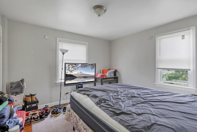 bedroom with hardwood / wood-style flooring