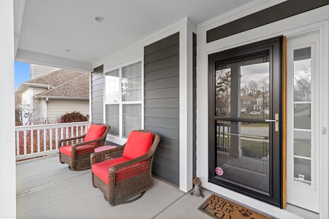 view of exterior entry featuring a porch