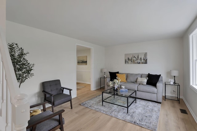 living room with light hardwood / wood-style floors