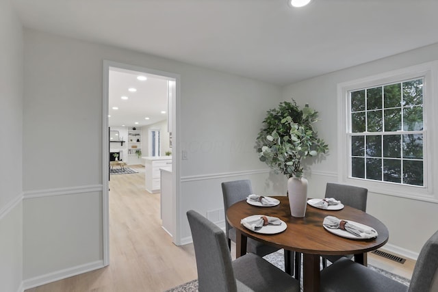 dining area with light wood-type flooring