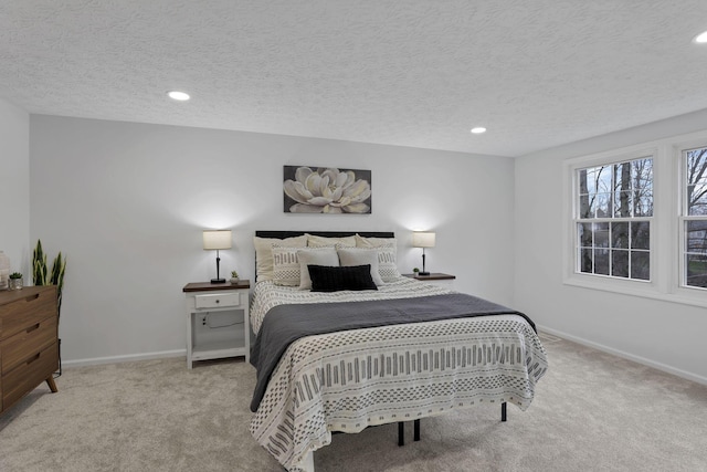 carpeted bedroom with a textured ceiling