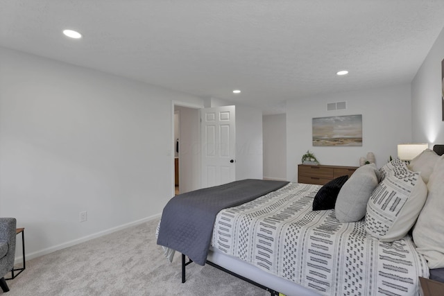 bedroom with light colored carpet