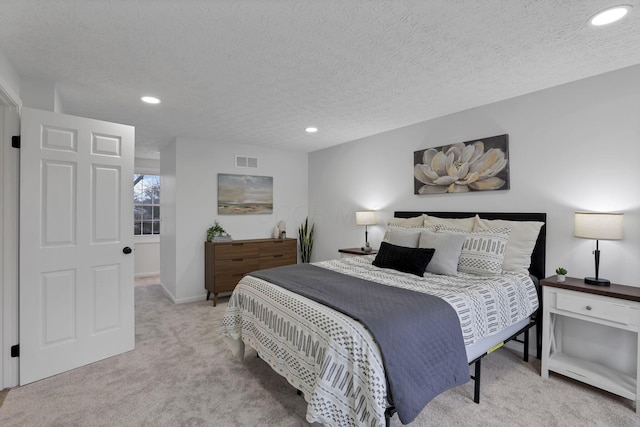 carpeted bedroom with a textured ceiling