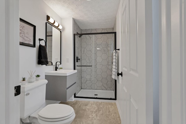 bathroom with walk in shower, tile patterned flooring, a textured ceiling, toilet, and vanity