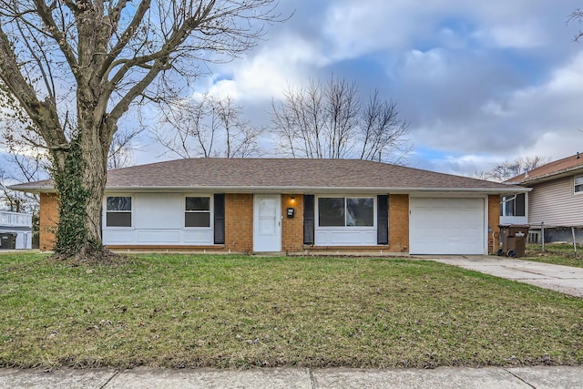 ranch-style house featuring a garage and a front lawn