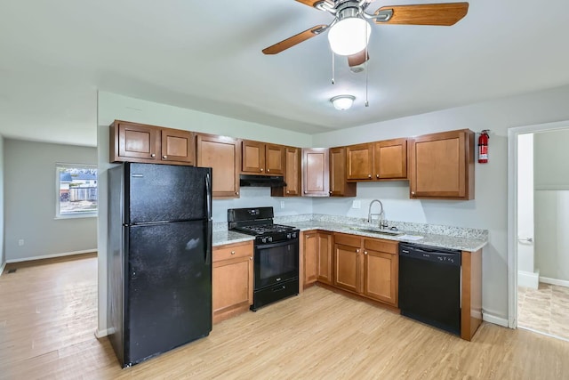 kitchen with ceiling fan, sink, light hardwood / wood-style flooring, and black appliances