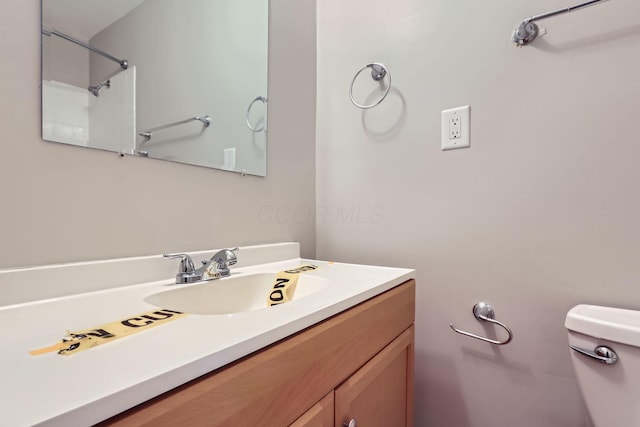 bathroom with vanity and toilet