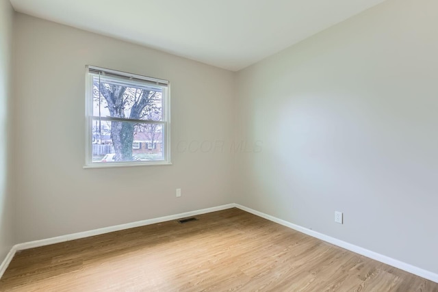 unfurnished room featuring light wood-type flooring