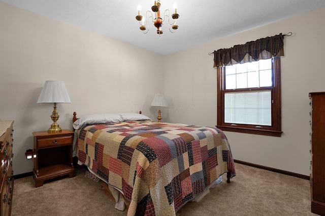 bedroom featuring light colored carpet and a notable chandelier