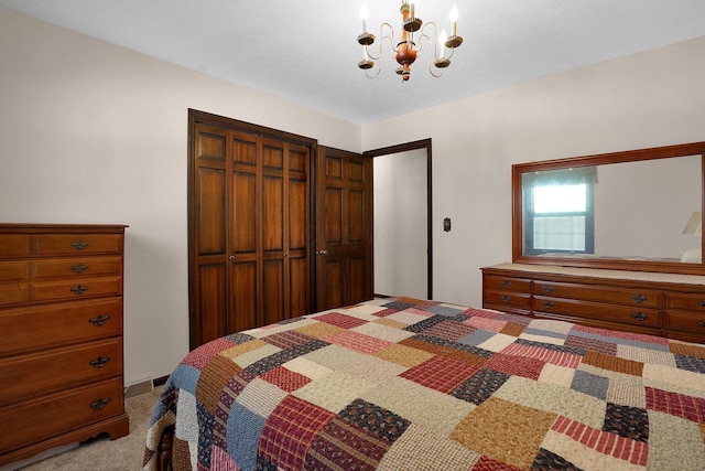 carpeted bedroom with an inviting chandelier and a closet