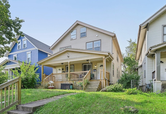 view of front facade with a front yard and a porch