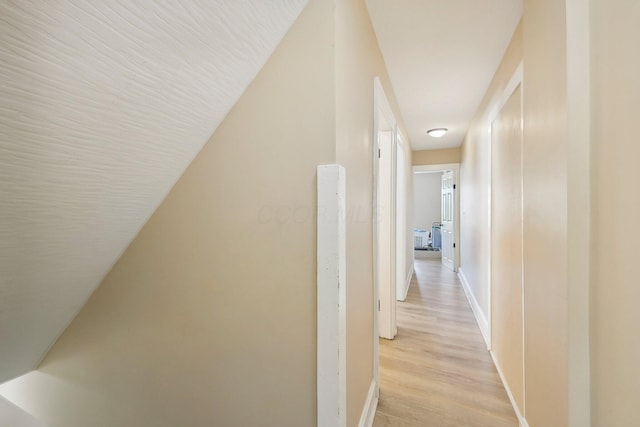 hallway with light wood-type flooring