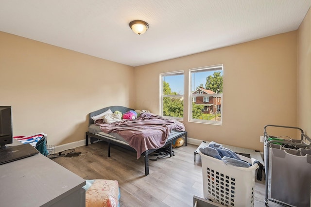 bedroom with light hardwood / wood-style flooring