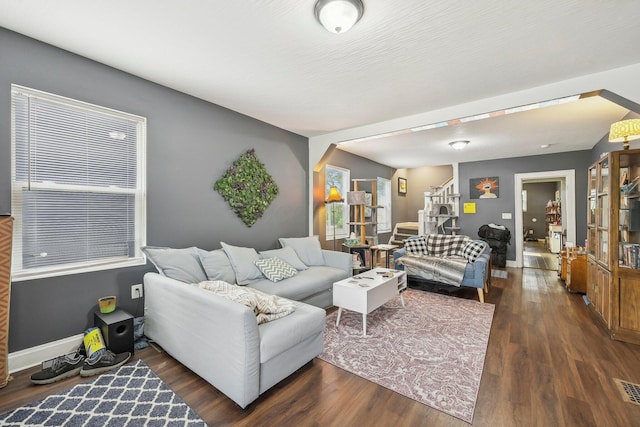 living room with dark hardwood / wood-style floors