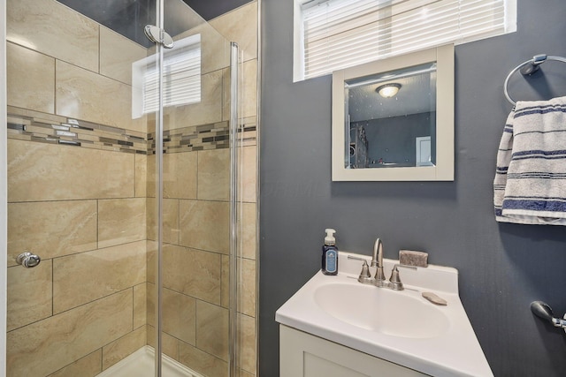 bathroom featuring sink and an enclosed shower