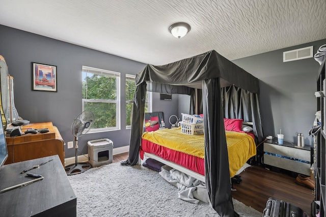 bedroom featuring dark hardwood / wood-style floors