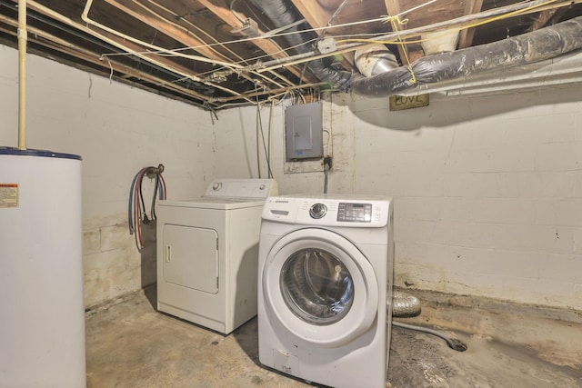 clothes washing area featuring washer and dryer, electric panel, and water heater