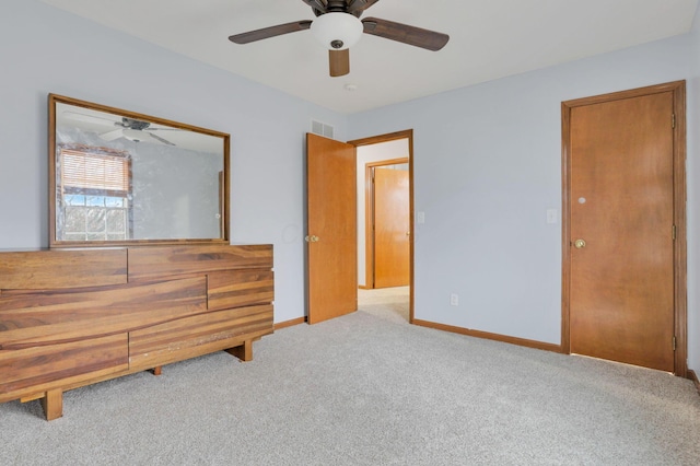 unfurnished bedroom with ceiling fan and light colored carpet