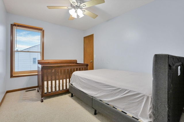 carpeted bedroom featuring ceiling fan