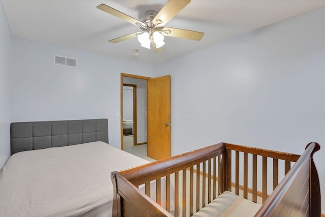 carpeted bedroom featuring ceiling fan