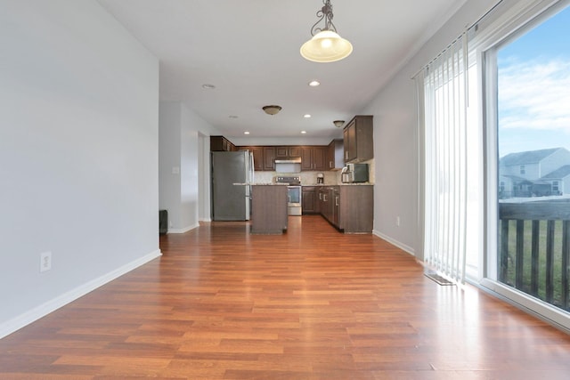 unfurnished living room featuring light hardwood / wood-style flooring