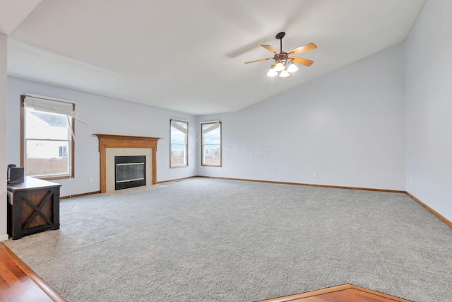 unfurnished living room featuring ceiling fan, light hardwood / wood-style flooring, and lofted ceiling