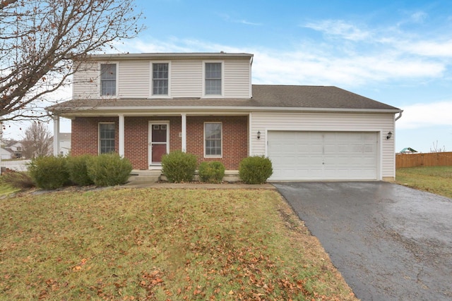 front facade with a front lawn and a garage