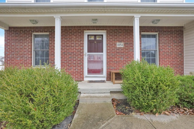 property entrance featuring covered porch