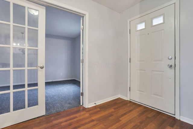 entrance foyer with dark hardwood / wood-style floors