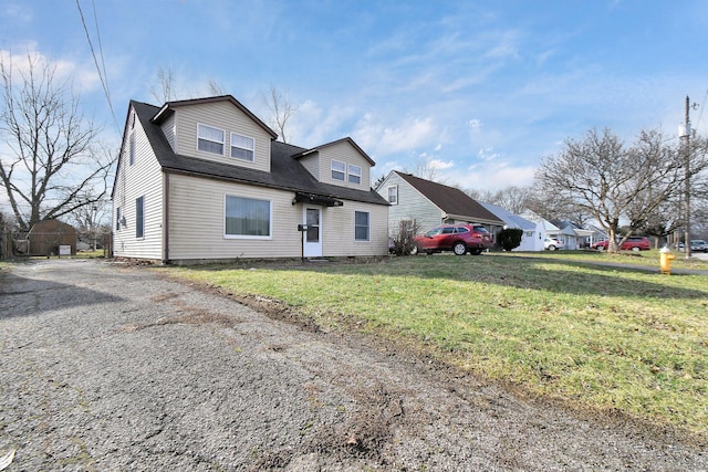 view of front of home with a front yard