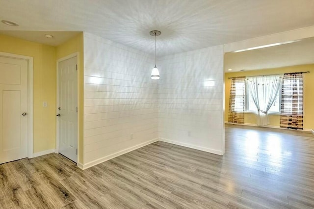 spare room featuring hardwood / wood-style floors