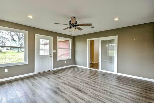 interior space featuring ceiling fan and light wood-type flooring