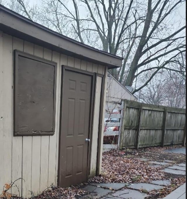 view of shed with fence