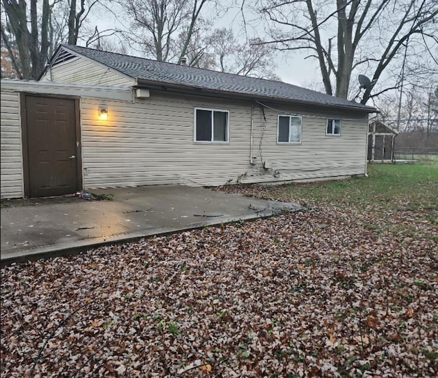 back of property with a patio