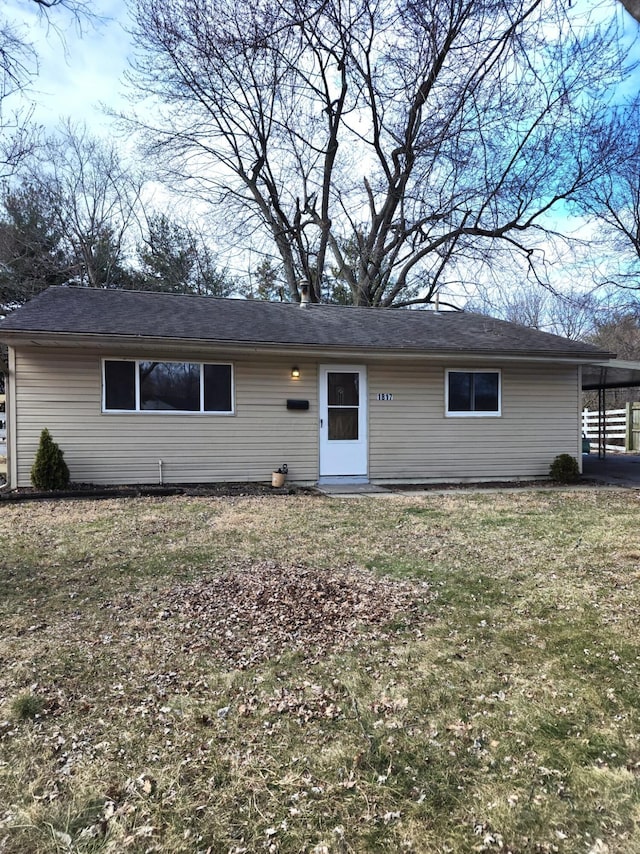 ranch-style house with a front lawn