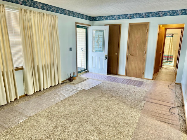 entryway featuring a textured ceiling