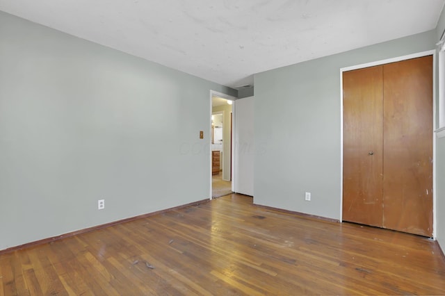 unfurnished bedroom featuring hardwood / wood-style floors