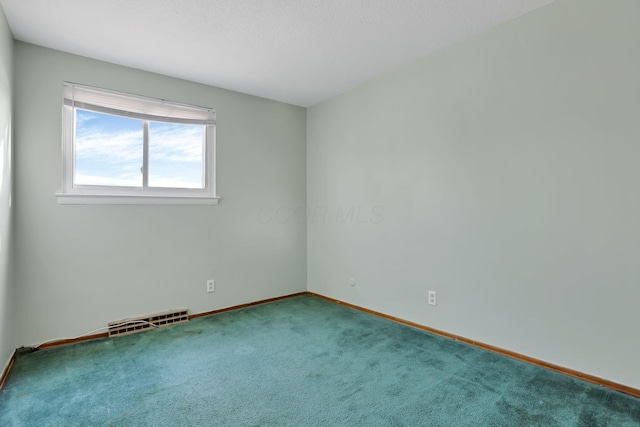 unfurnished room with carpet floors